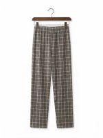 Women's fleece pajama set with dusty mauve full-sleeve sweatshirt and gray-brown checkered pants.