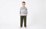 A baby boy is wearing the Fleece Fabric set by Freeland Galleria.