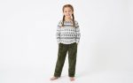 A baby girl is wearing the Fleece Fabric set by Freeland Galleria.